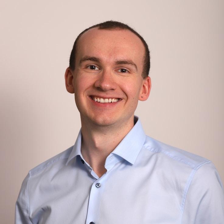 Ava Kapoor, Lead Design Curator at Future Data Exchange, reviewing corporate floral arrangements